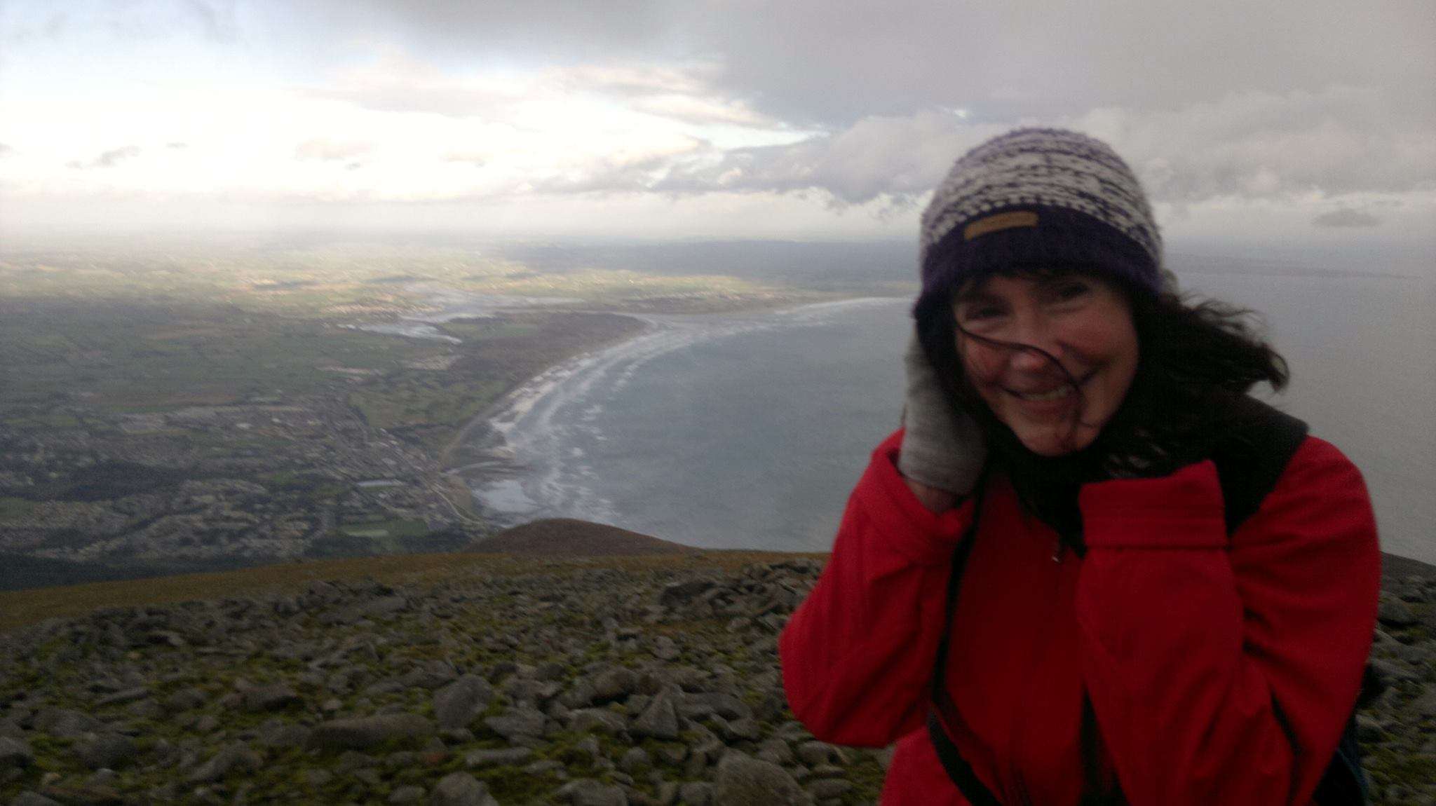 Ann Marie Dunne on mountain with county Down coastline in background