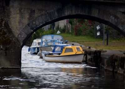 Moored boats under a arch of Leighlinbridge Town Bridge