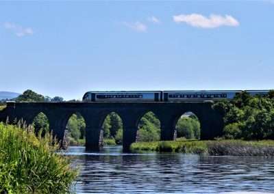 Train crossing Fenniscourt railway bridge over the river Barrow in Carlow, Ireland