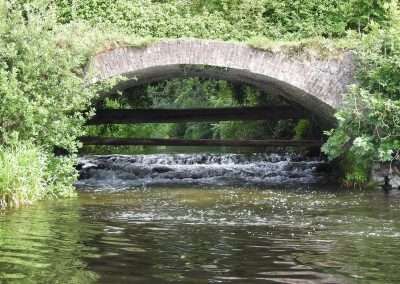 Mouth of the river Griese under a bridge entering river Barrow at Maganey, Kildare, Ireland