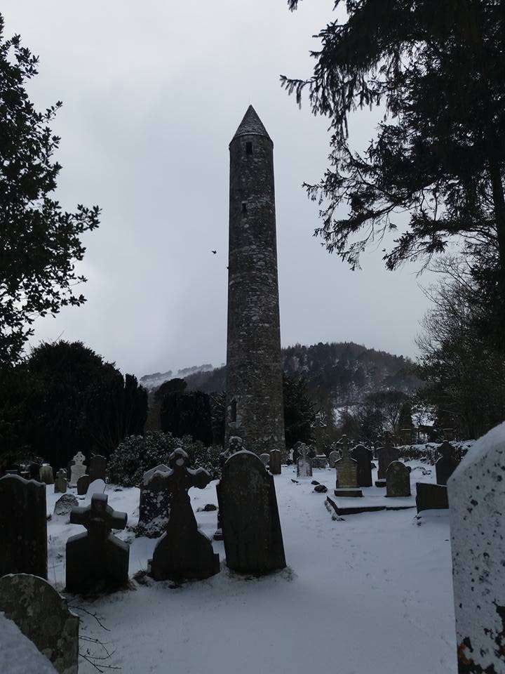 Round Tower of Glendalough in snow
