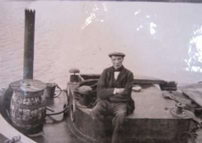 Workman sitting on a barge