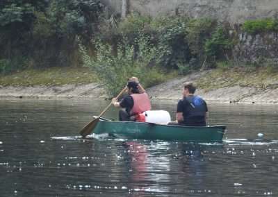 Ireland By Canoe team paddling a green canoe on the river Nore