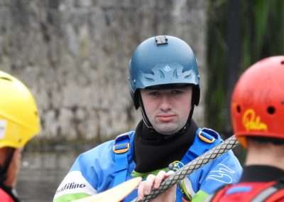 Kayaker with helmet on water in Kilkenny