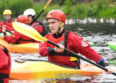 Young man learning Level 2 kayaking skills on river Nore