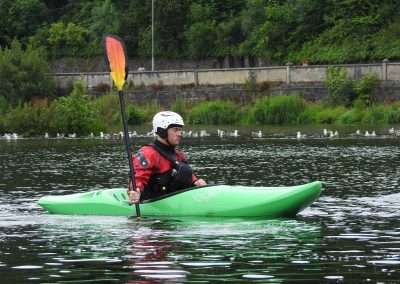 Kayaker taking a break on the river Nore