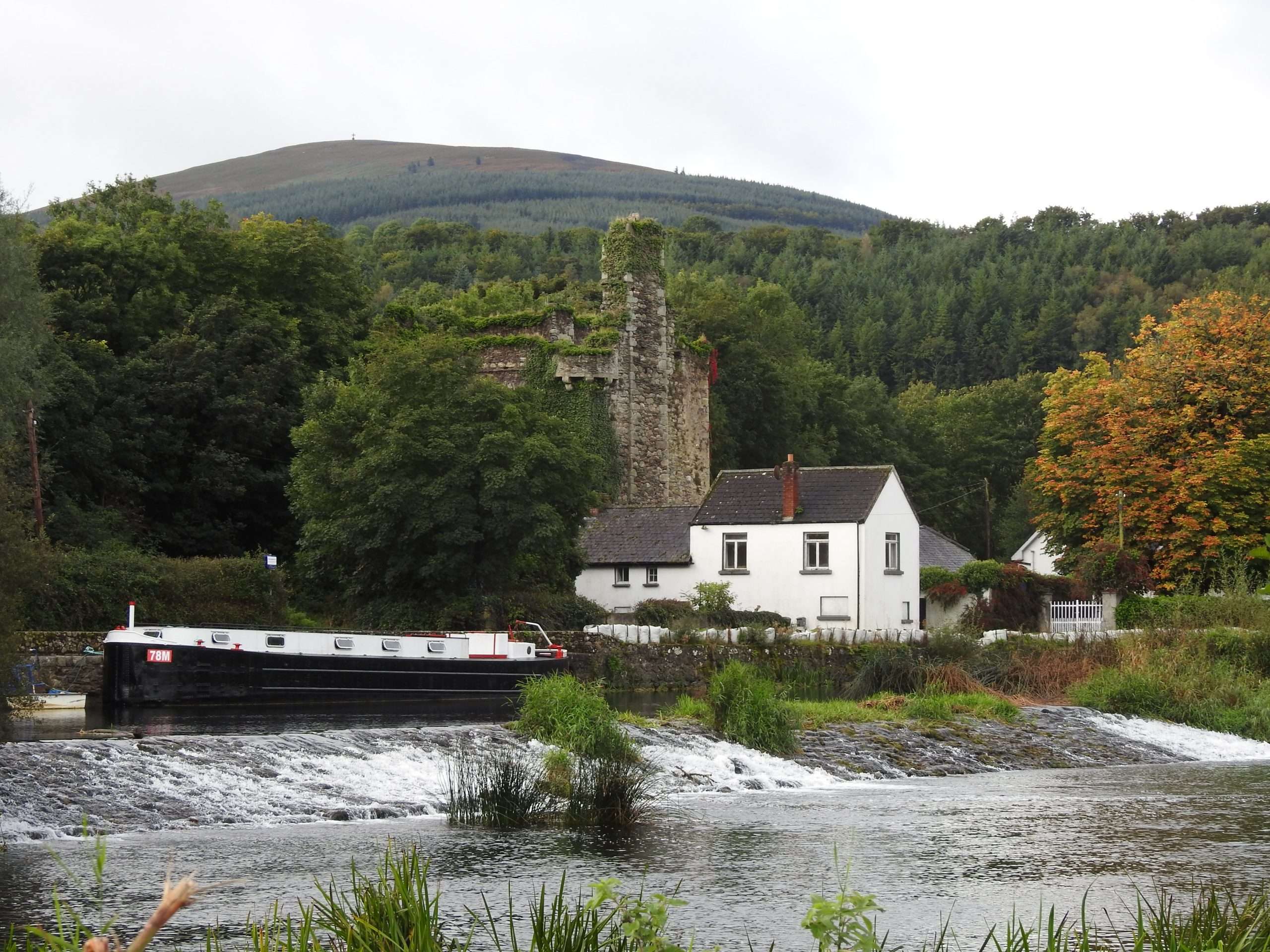View of the weir, the lock house and Brandon hill looking over the river Barrow