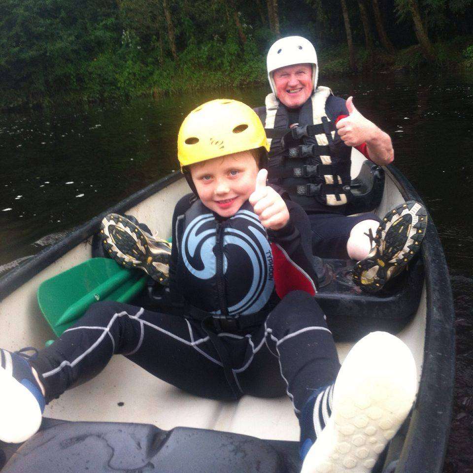 Cein Stynes and his grandad Martin Reid in a Canoe on the river Barrow in county Carlow