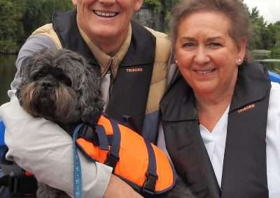 Dog and owners wearing life jackets