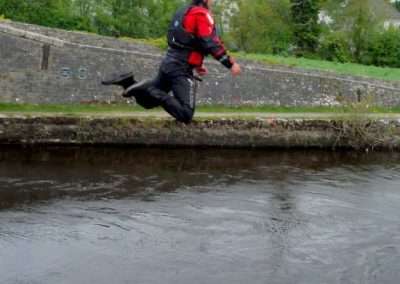 Cliff Reid mid air after jumping off the horse bridge on river Barrow